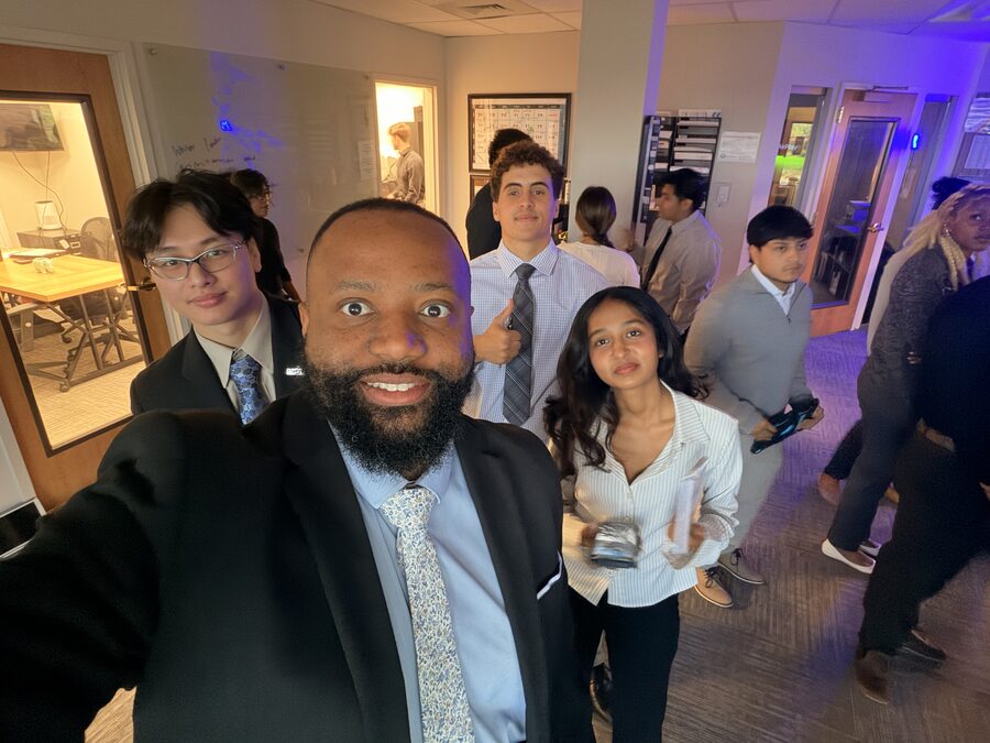 Empire Acquisitions team members on the office floor as the day starts