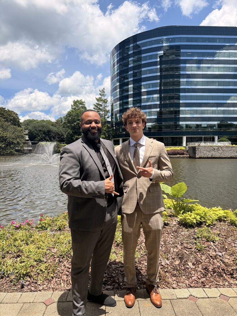 An Empire Acquisitions mentor and representative outside the office building